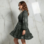 Woman in printed designer dress with long sleeves and ruffled hem, Ivorynn fashion