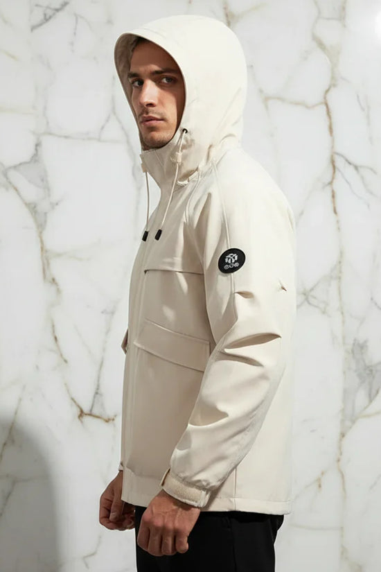 Side profile - sporty man in off-white jacket