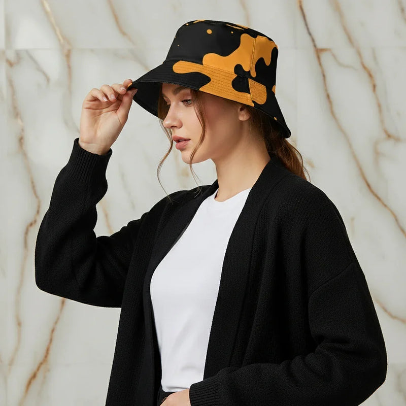 Woman in modern black and yellow bucket hat, black cardigan, and white shirt, Ivorynn fashion