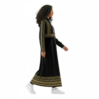 Woman in black and gold embroidered maxi dress with hoodie, walking, Ivorynn fashion
