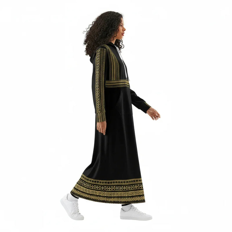 Woman in black and gold embroidered maxi dress with hoodie, walking, Ivorynn fashion