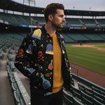 Stylish man in graphic jacket and yellow sweater at stadium, modern men's fashion from Ivorynn