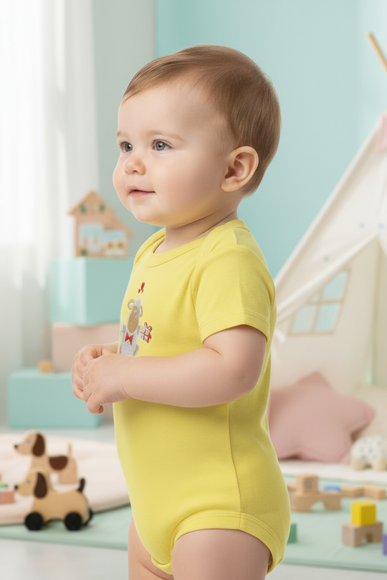 Side view of baby in yellow onesie