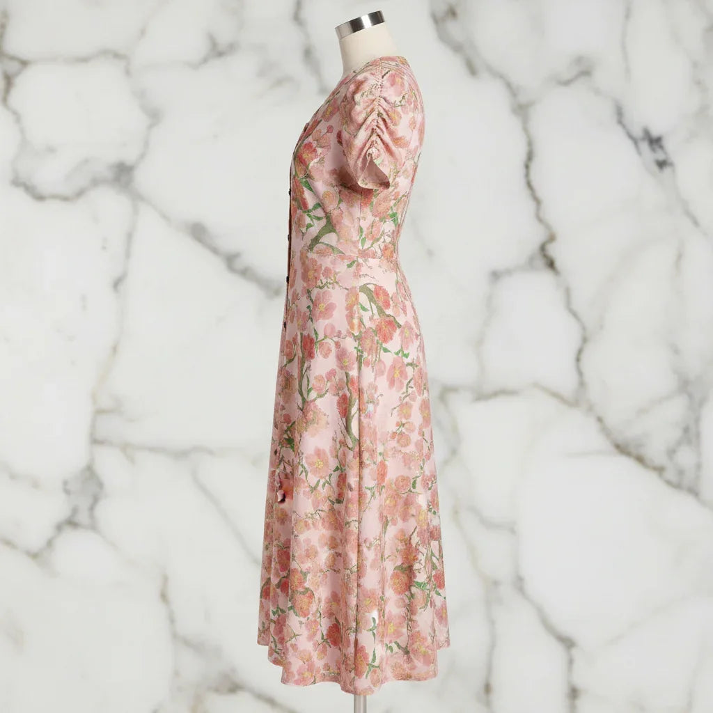 Side view of floral pink midi dress on mannequin, stylish women's fashion from Ivorynn