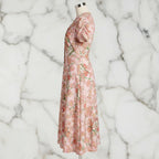 Side view of floral pink midi dress on mannequin, stylish women's fashion from Ivorynn