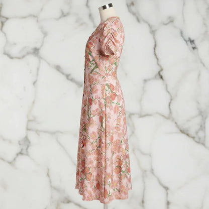Side view of floral pink midi dress on mannequin, stylish women's fashion from Ivorynn