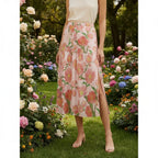 Woman wearing a floral slit midi skirt in a colorful garden, stylish fashion at Ivorynn