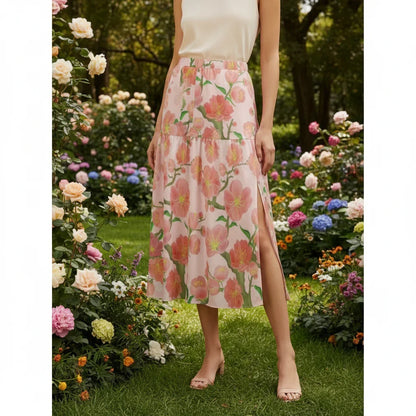 Woman wearing a floral slit midi skirt in a colorful garden, stylish fashion at Ivorynn