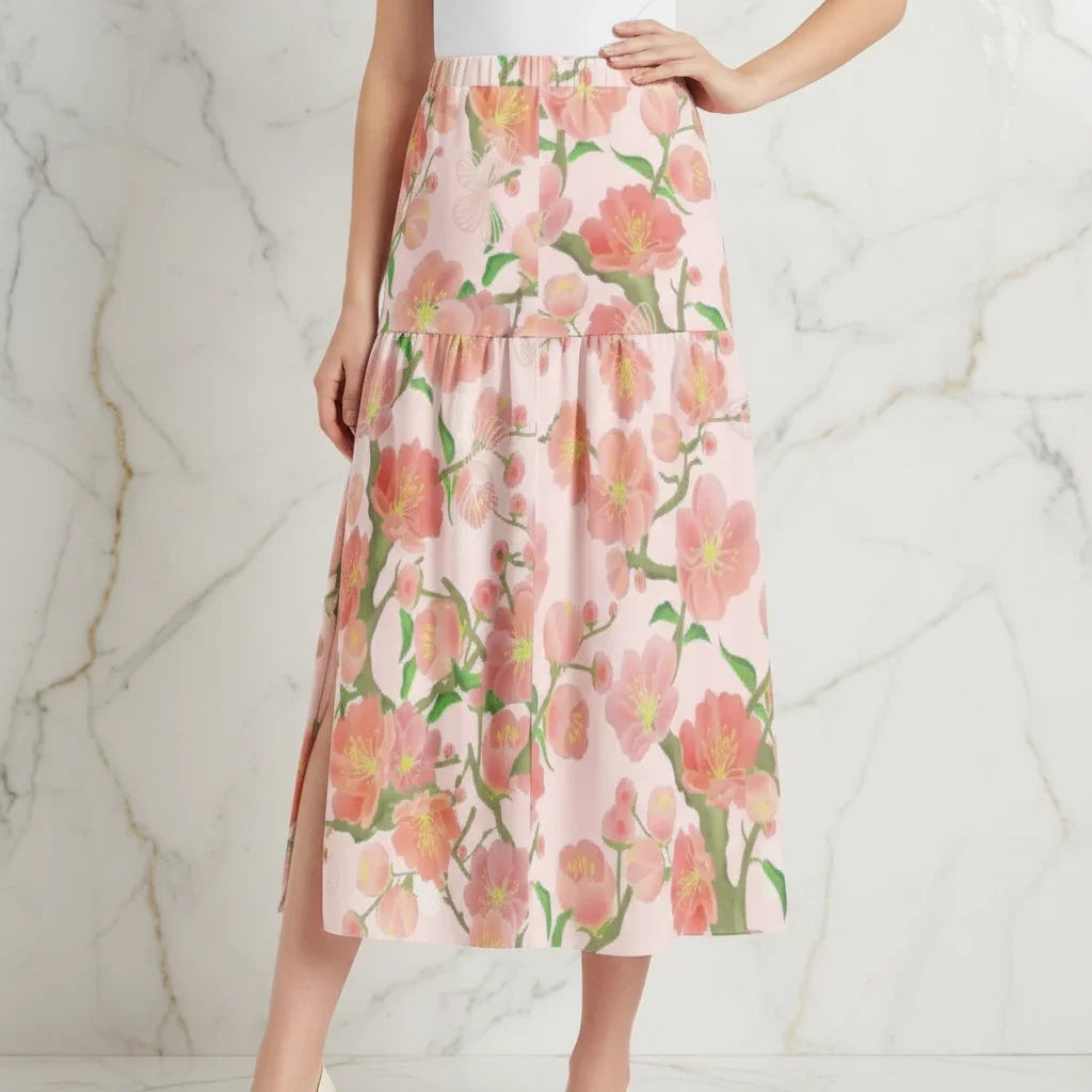 Woman modeling pink floral maxi skirt with left slit, stylish fashion from Ivorynn