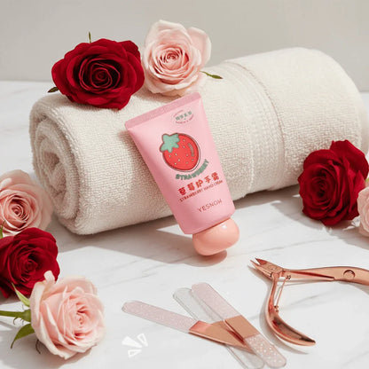 Fruit Fragrance Milky Hand Cream tube beside rolled towel and roses on marble surface.