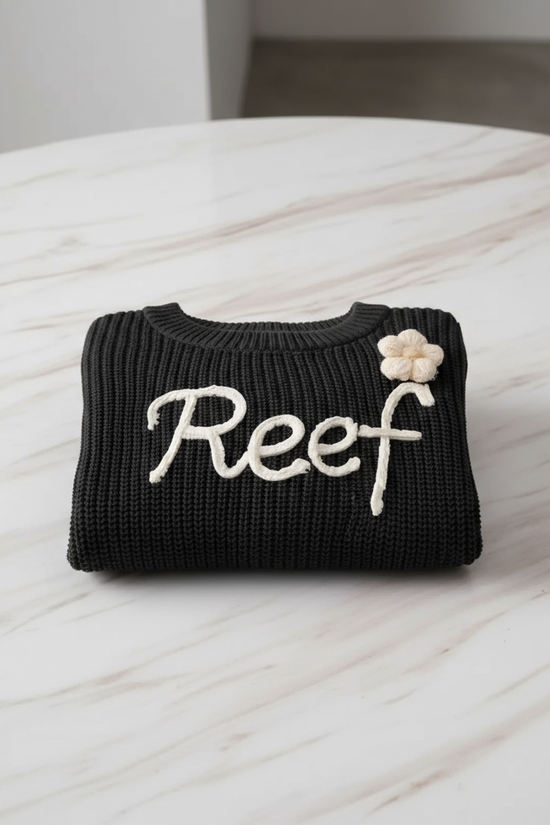 Sweater folded on marble