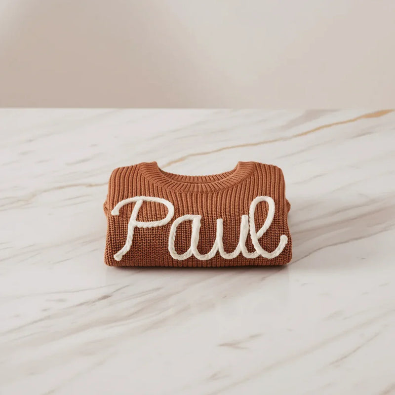 Sweater folded on marble