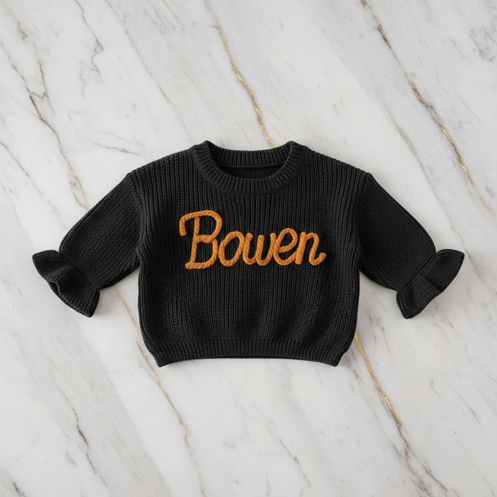 Sweater laid flat on marble