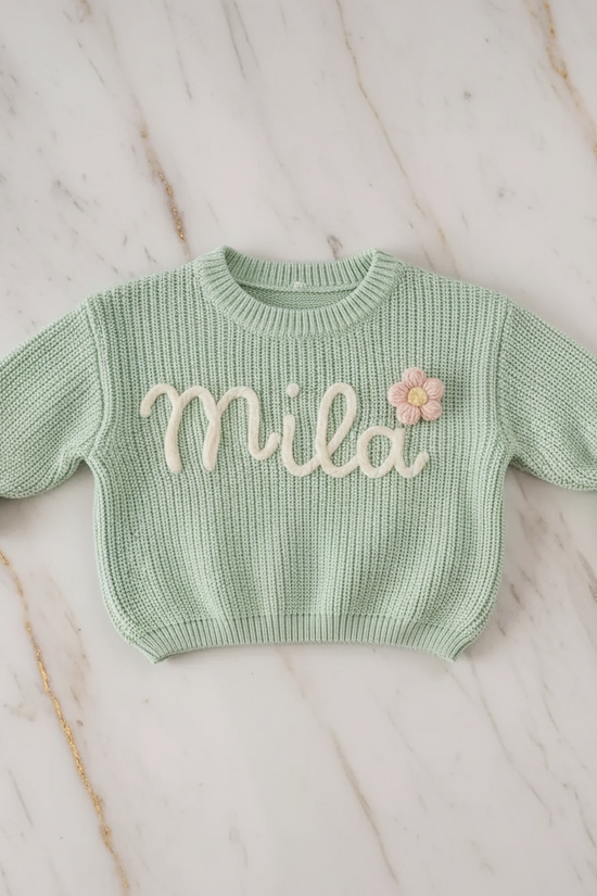 Sweater laid flat on marble