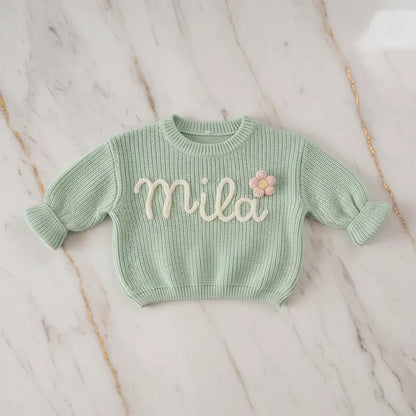 Sweater laid flat on marble