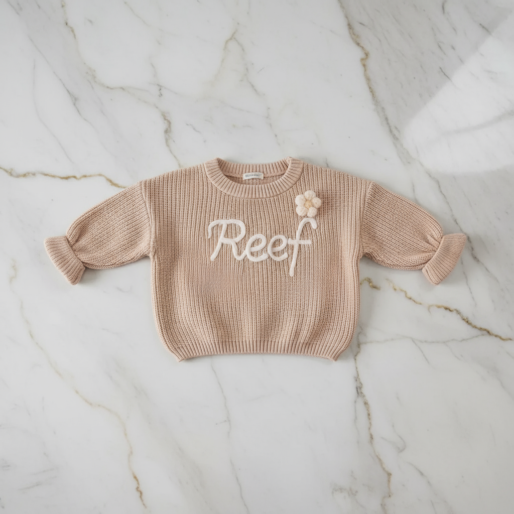 Sweater laid flat on marble