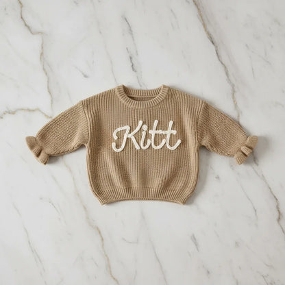 Sweater laid flat on marble