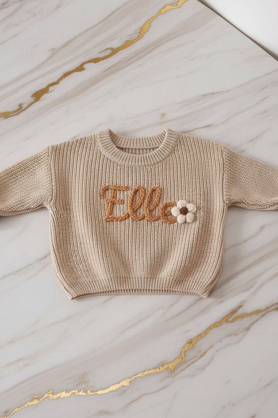 Sweater laid flat on marble