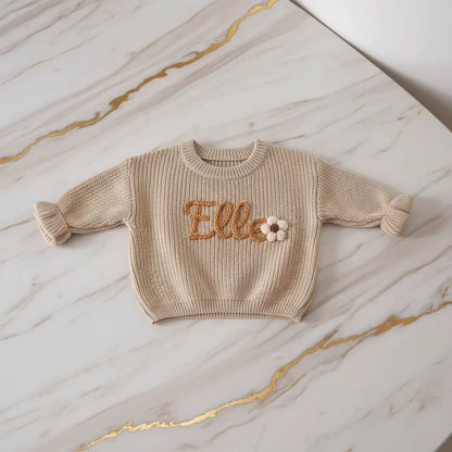 Sweater laid flat on marble