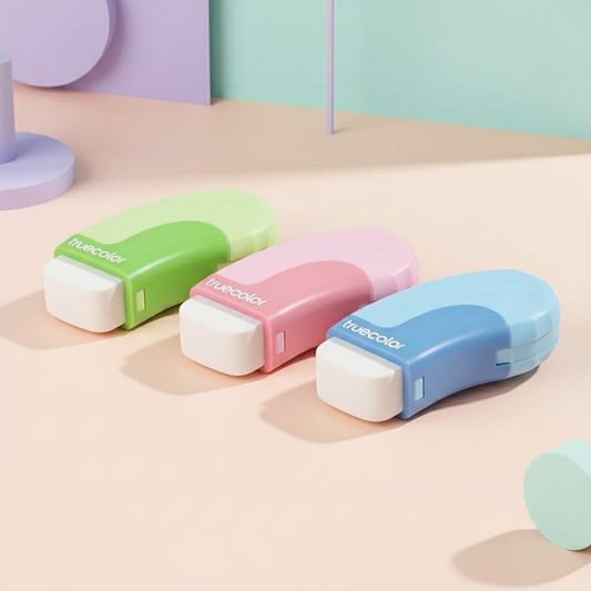 Three erasers lying flat on pastel table