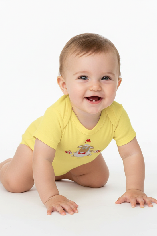 Three-quarter angle of baby in yellow onesie