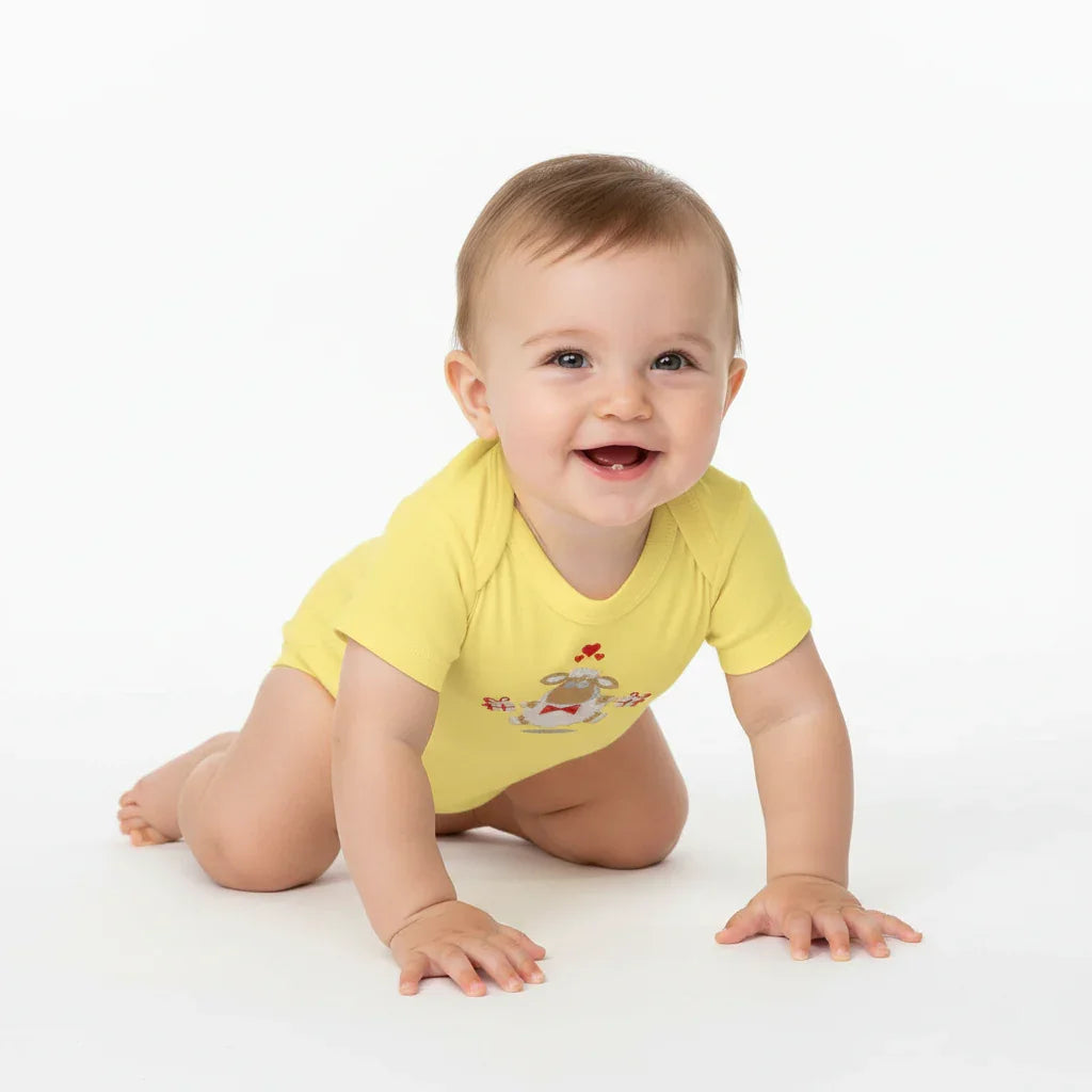 Three-quarter angle of baby in yellow onesie