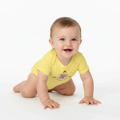 Three-quarter angle of baby in yellow onesie