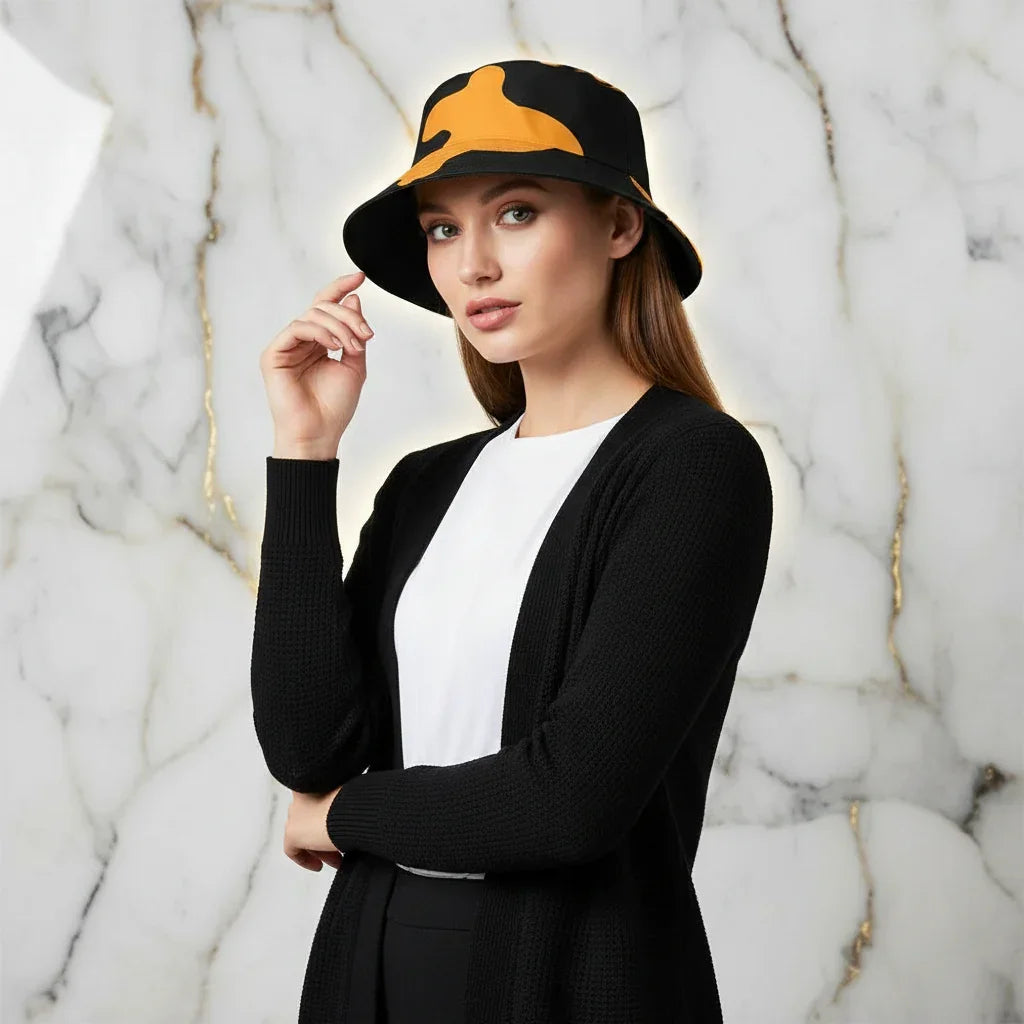 Woman in black and yellow bucket hat and black cardigan, stylish fashion at Ivorynn