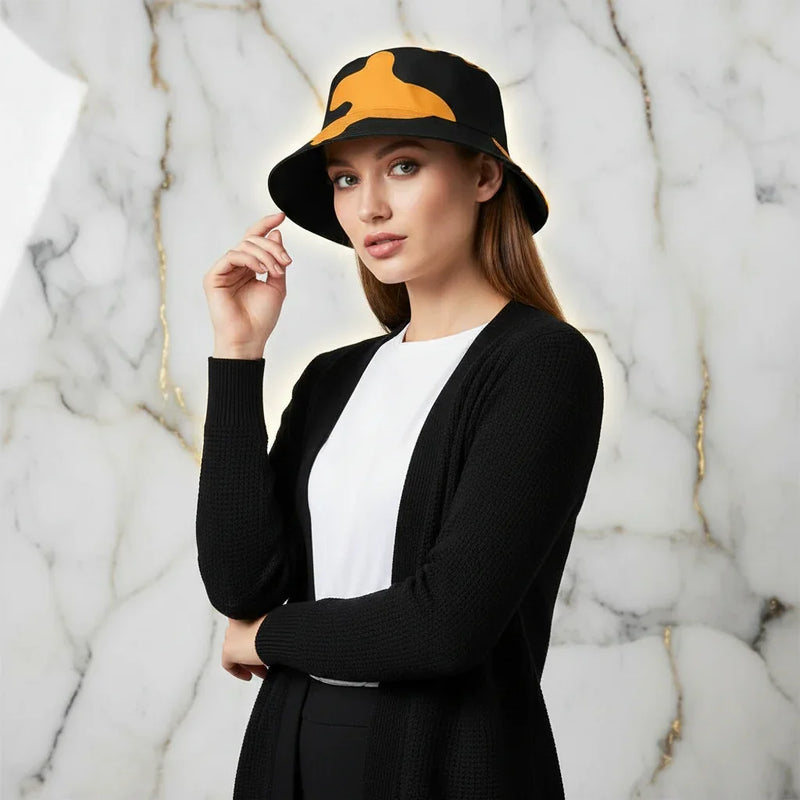 Woman in black and yellow bucket hat and black cardigan, stylish fashion at Ivorynn