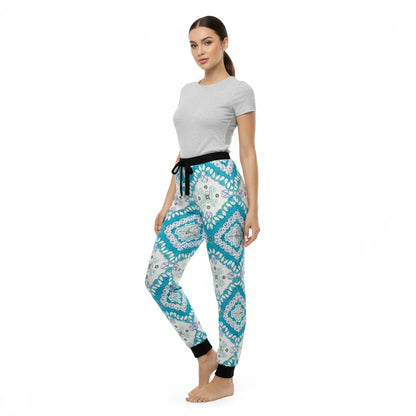 Woman wearing grey t-shirt and blue patterned jogger pants from Ivorynn fashion collection