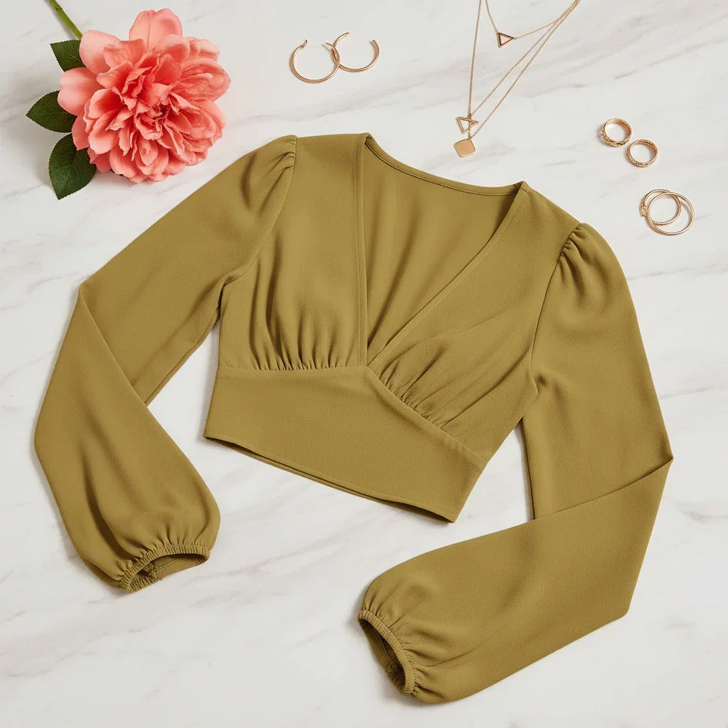 Three-quarter angle with modern geometric jewelry and coral flower