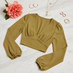 Three-quarter angle with modern geometric jewelry and coral flower