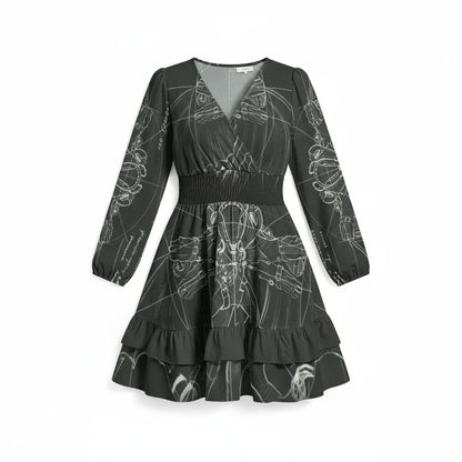 Black long sleeve women's dress with white abstract print, ruffle hem, and shirred waist from Ivorynn