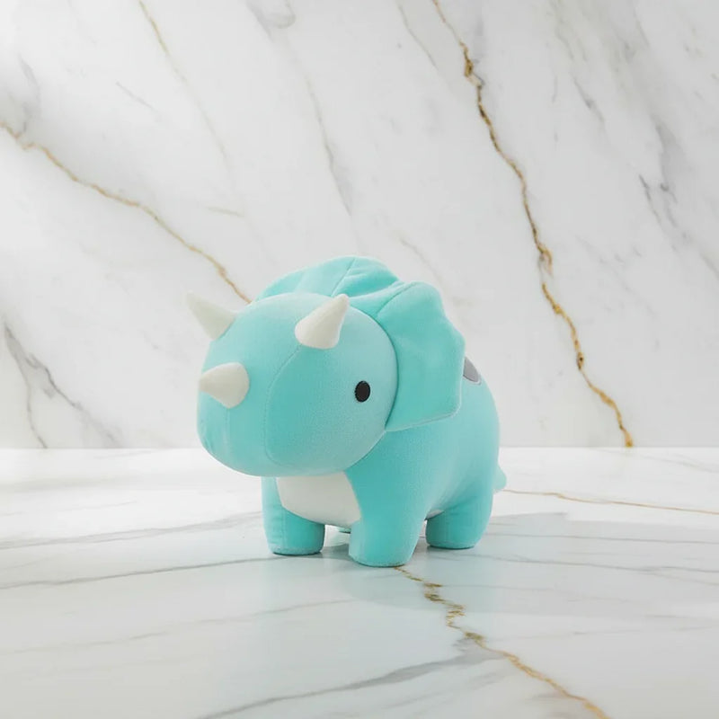 Turquoise dinosaur on marble