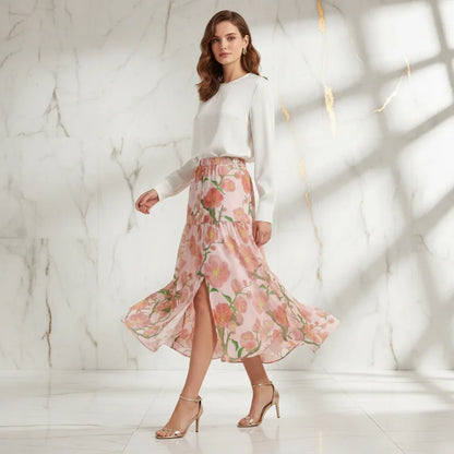 Stylish woman in white blouse and floral pink skirt with heels, Ivorynn fashion apparel