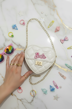 White bag - hand with chain and accessories