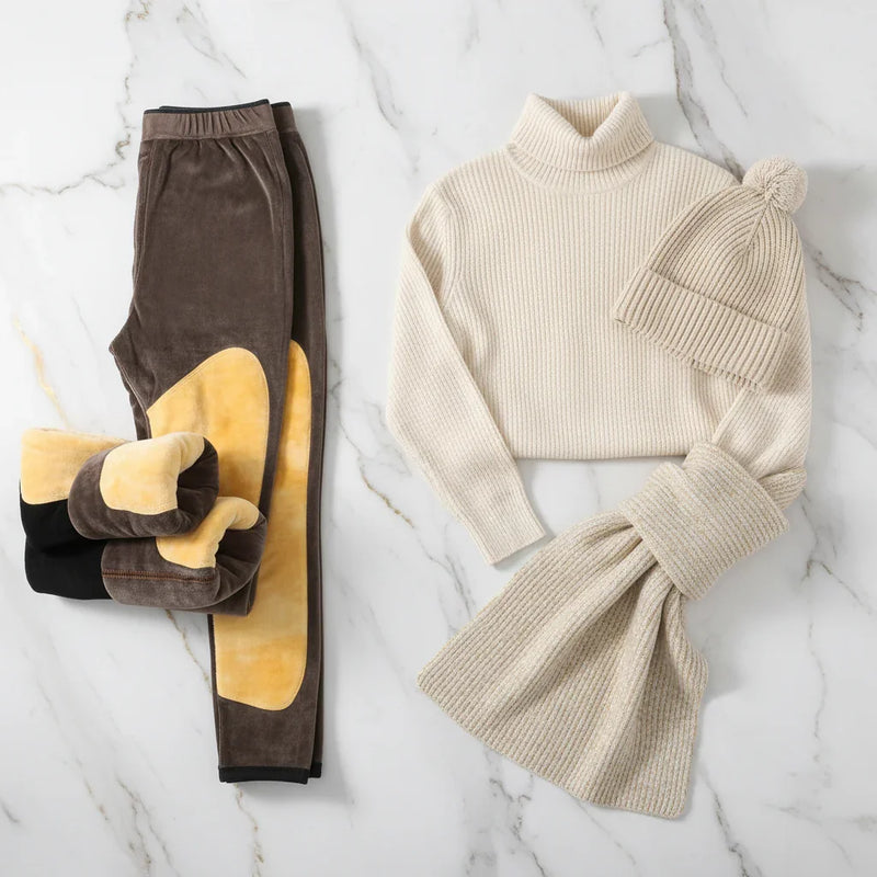 Winter outfit flat lay with turtleneck, scarf, and hat