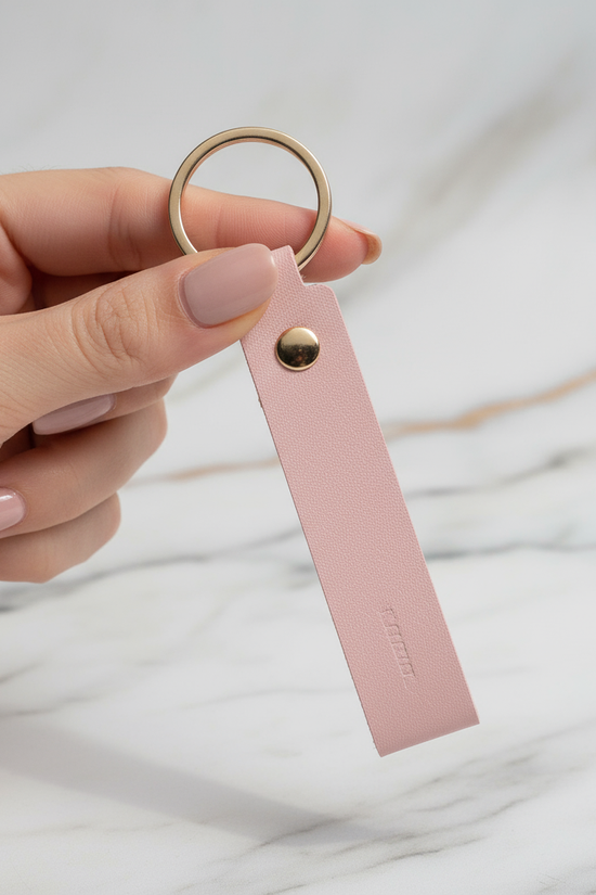 Woman holding keychain - back view