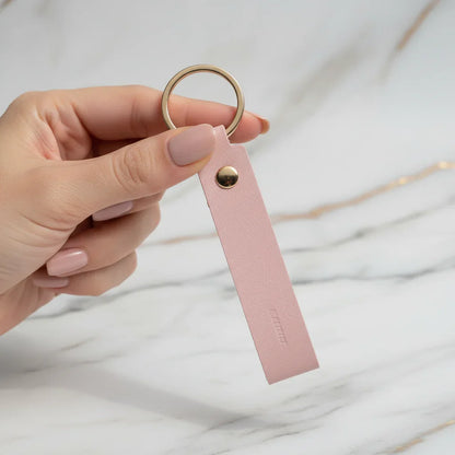 Woman holding keychain - back view