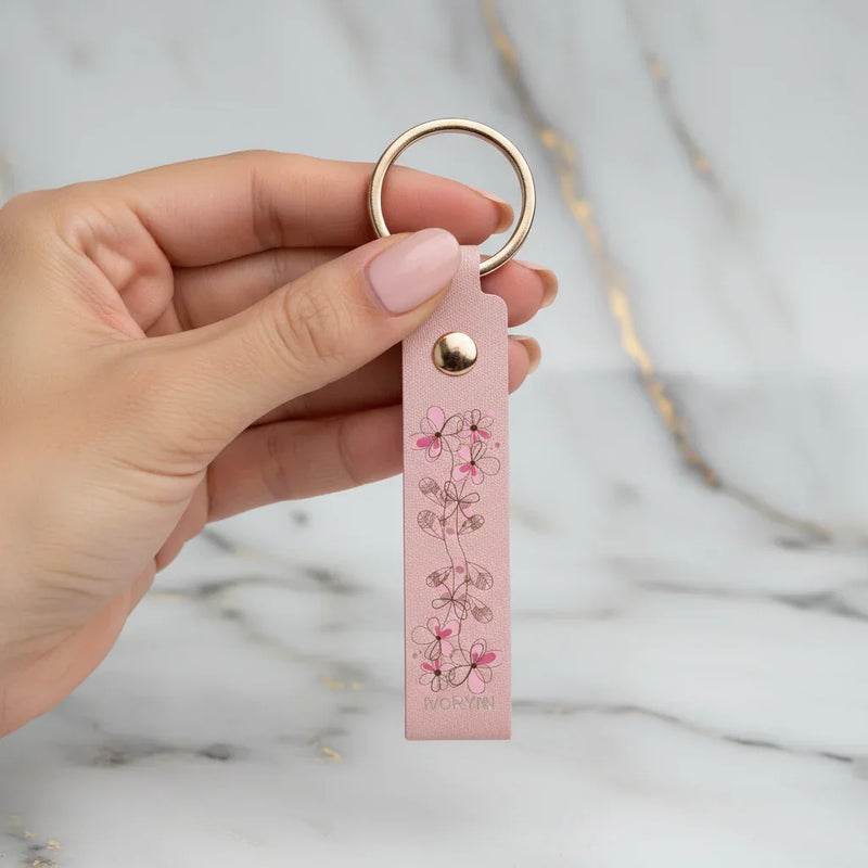 Woman holding keychain - close-up detail