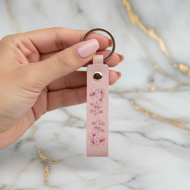 Woman holding keychain - front view