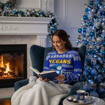 Woman in Christmas sweater with blue ornaments