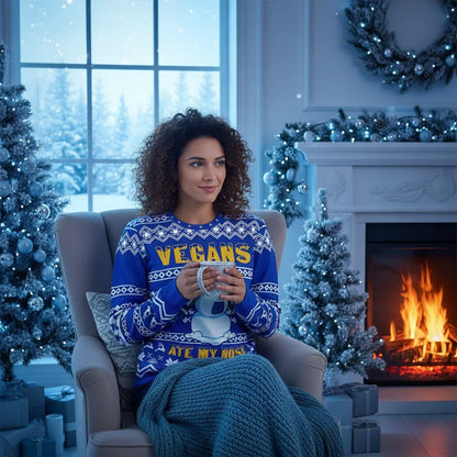 Woman in Christmas sweater with blue-toned lighting