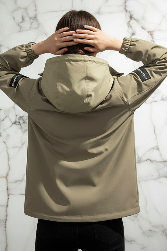Woman in Khaki Jacket Back View Hands on Head