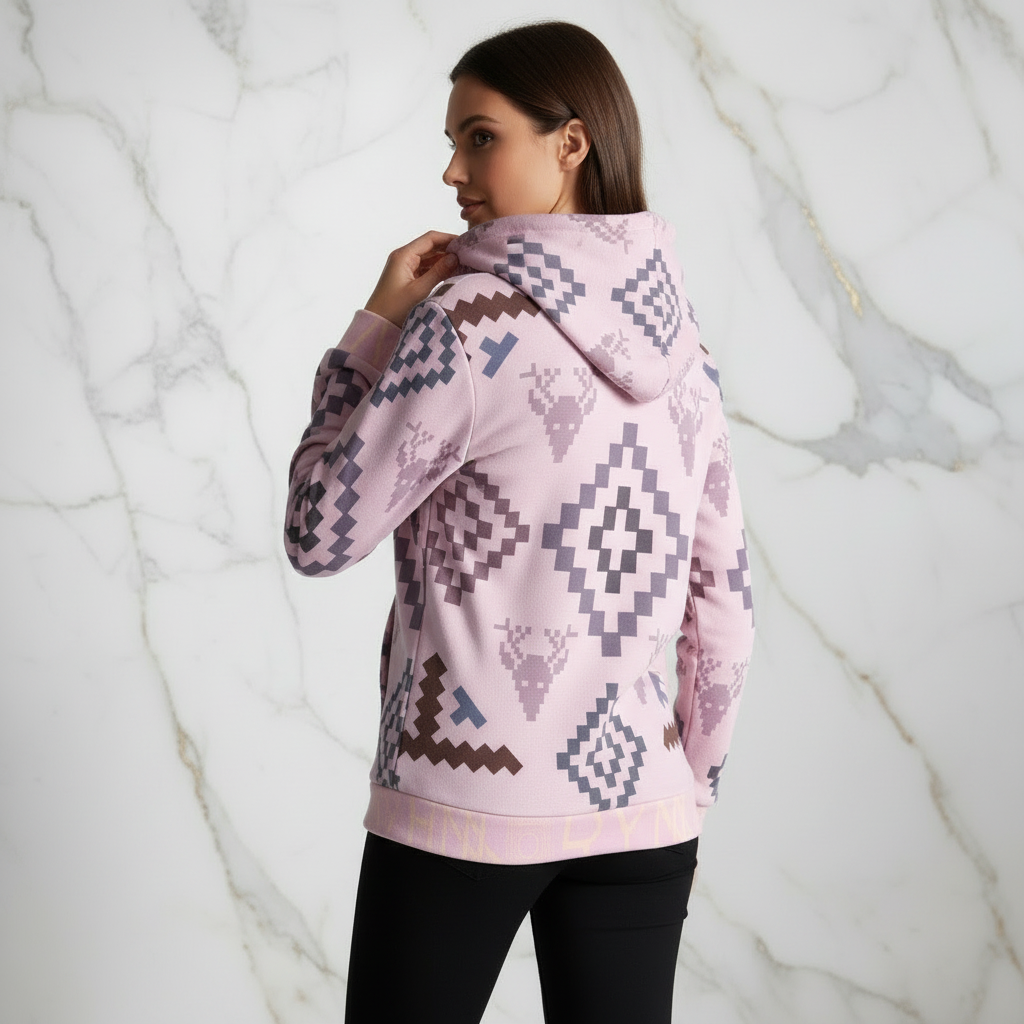 Woman in pink geometric hoodie - back with hand on hood