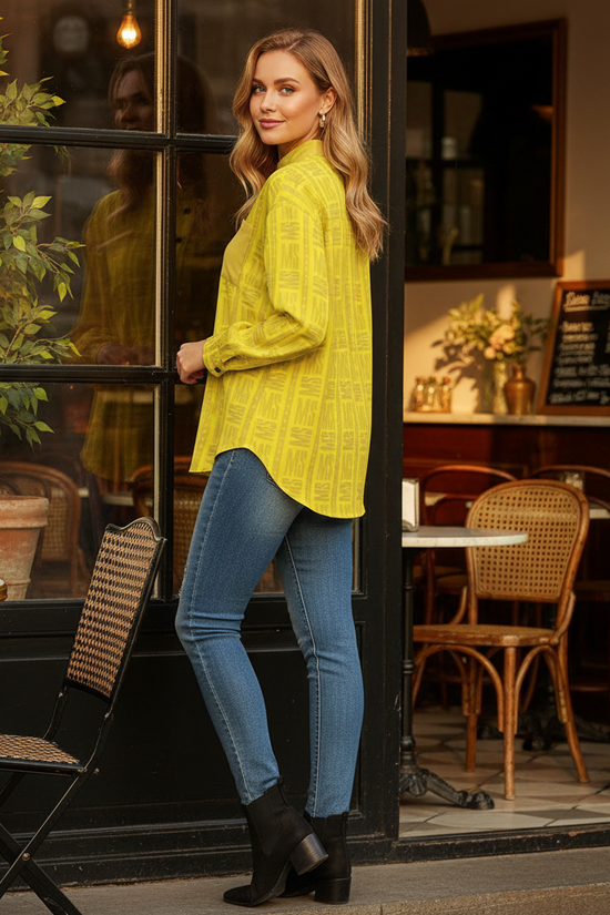 Woman in yellow shirt by café window