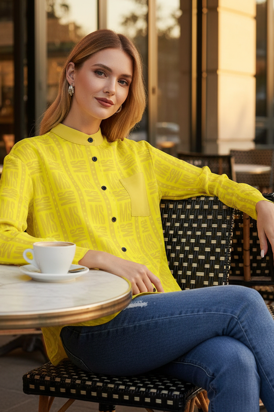 Woman in yellow shirt relaxing at café