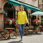Woman in yellow shirt walking past café