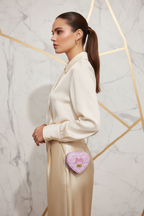 Woman side pose - Mini Heart Barbie Bag