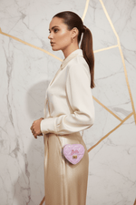 Woman side pose - Mini Heart Barbie Bag